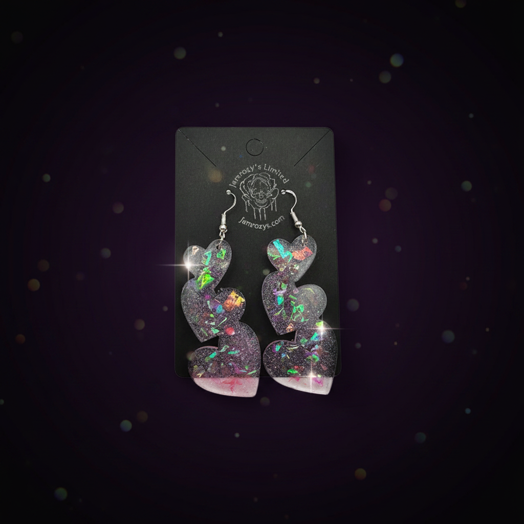 pinkish clear sparkly dangle earrings set on a black display card