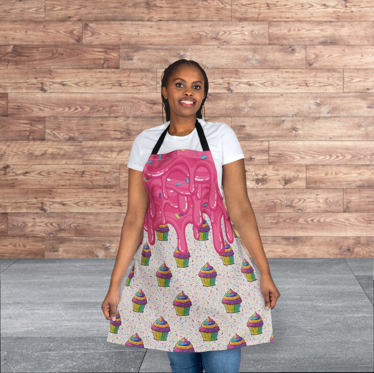 Jamrozy's Limited Company polyester canvas apron featuring a pink cupcake drip pattern and black tie-back straps