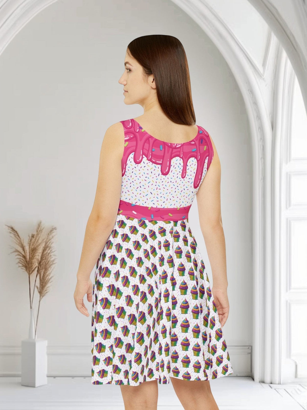 Jamrozy's Limited Company skater dress with pink frosting and cupcake print on a woman, back view