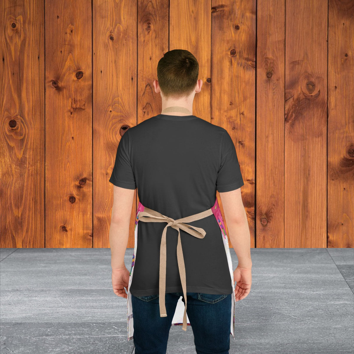 Jamrozy's Limited Company polyester canvas apron with beige tie-back straps worn by a man against a wood background