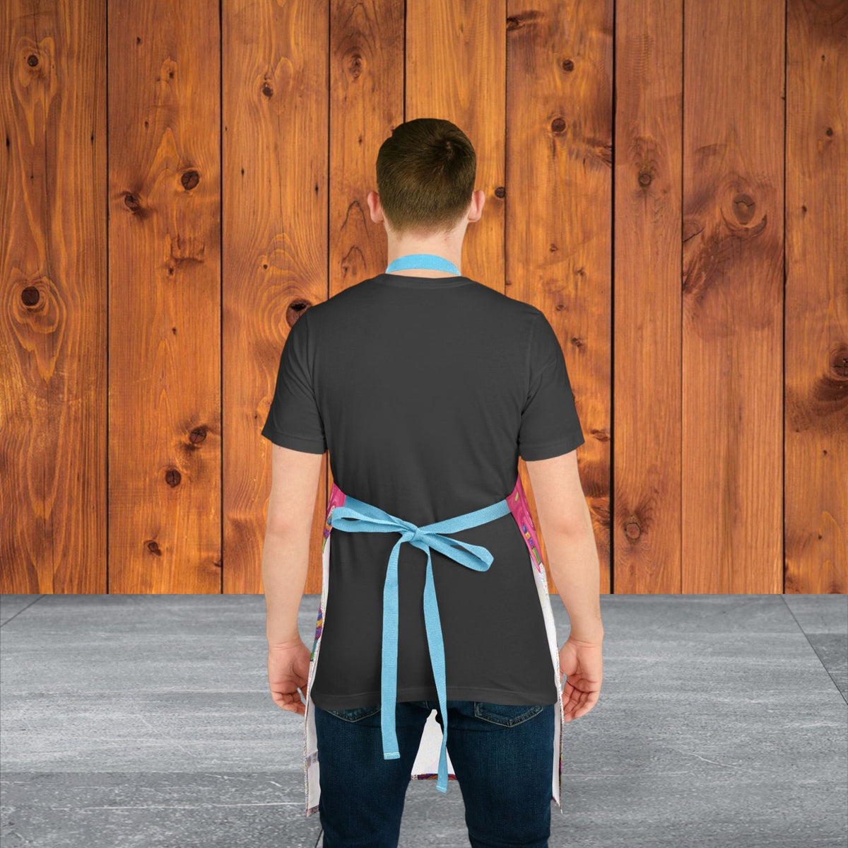 Jamrozy's Limited Company polyester canvas apron with blue tie-back straps worn by a man against a wood background